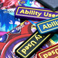 A total of 6 Ability Used markers in different colors with yellow text shown on top of various One Piece TCG cards.
