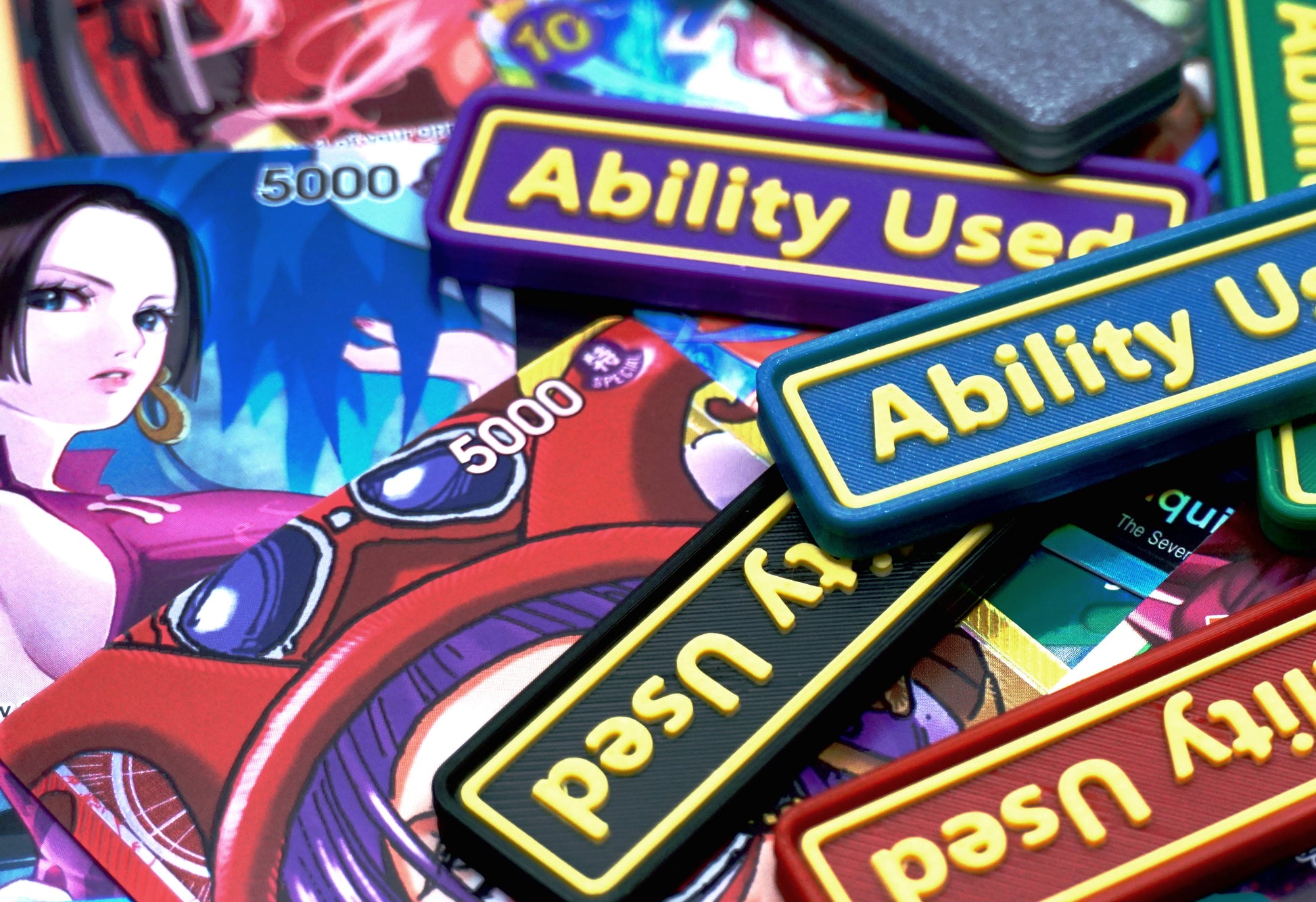 A total of 6 Ability Used markers in different colors with yellow text shown on top of various One Piece TCG cards.