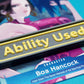 A black Ability Used marker with yellow text shown on top of a Boa Hancock card from the One Piece TCG.