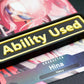 A black Ability Used marker with yellow text shown on top of a Hina card from the One Piece TCG.