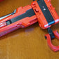 The Slip Grip in red attached to the black ripcord in the red launcher and red handle
