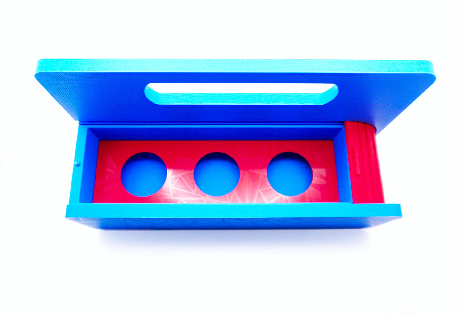 The Garage Door style deck box for Beyblade X in Sky Blue for the base with a red door and tray all against a white background