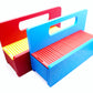 The Garage Door style deck box for Beyblade X in Sky Blue for the base with a red door and tray next to another one in red for the base and yellow for the door with all against a white background