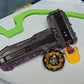 The orange Launcher Tab for Beyblade X on the black/grey string launcher and grip in a Takara Tomy stadium next to Emperor Might blade