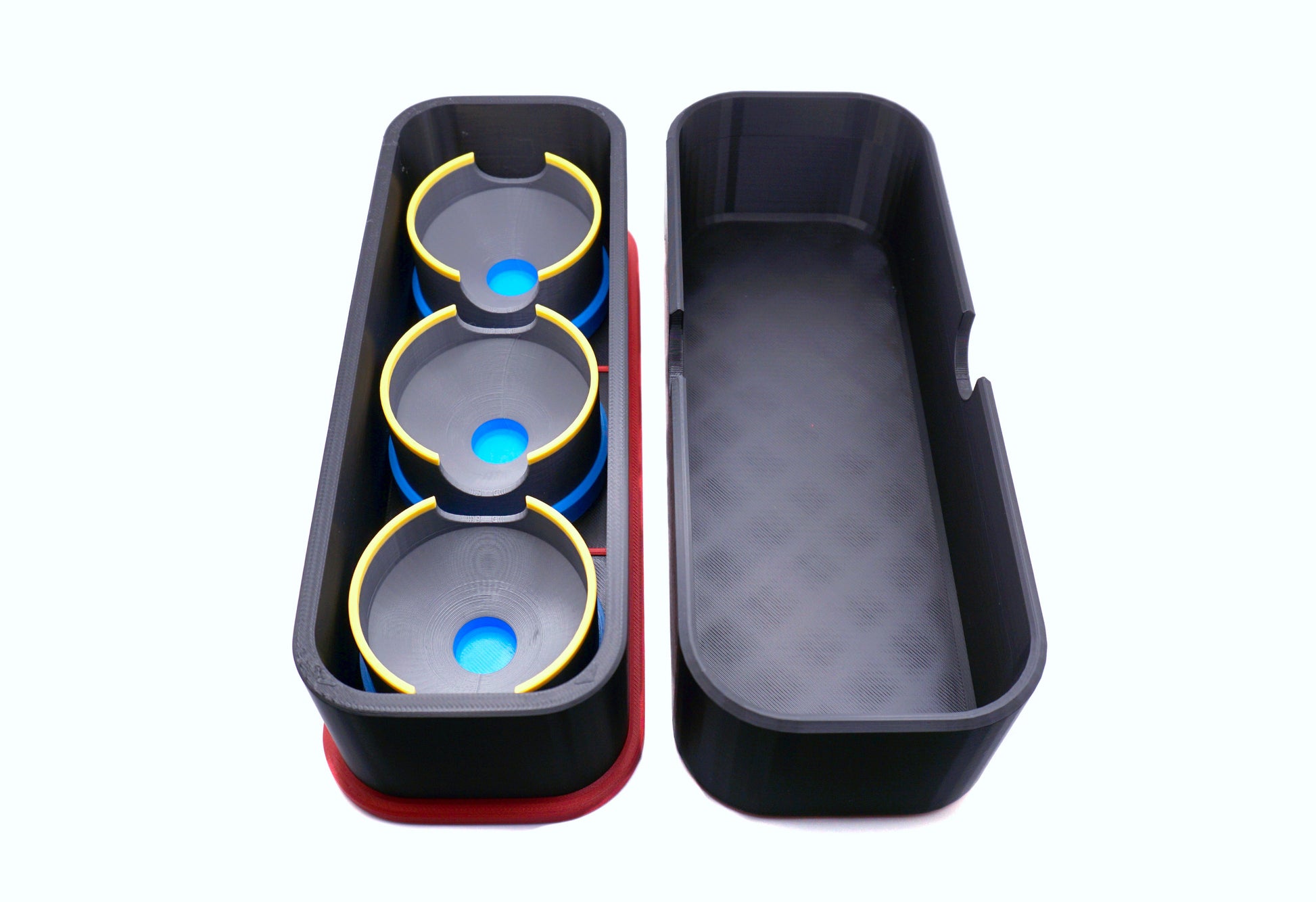 A side view of the inside base and top of the Beyblade X Deckbox from Momo's Models in the black and red color combination