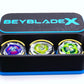 The Beyblade X Deckbox from Momo's Models shown in the black and sky blue color combination. With the lid sitting behind the base that has the Shark Scale, Hover Wyvern Pringle and Wizard Rod beyblades inside it. With everything against a white background