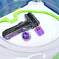 The purple Thumb Tab on the black string launcher with the grey handle grip. Sitting in the beyblade stadium with the Shark Scale