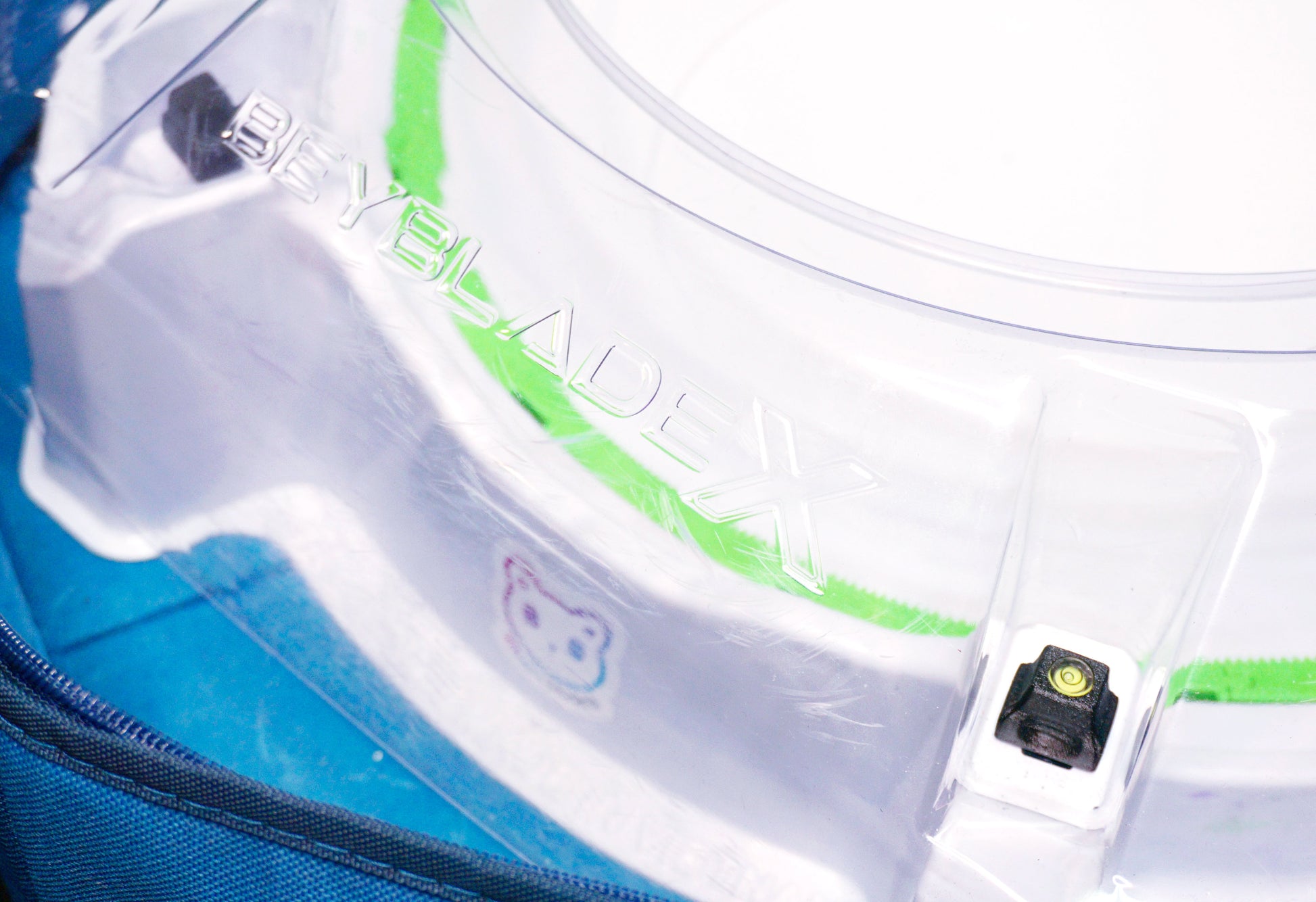 Stadium Level Locks in Black on the Takara Tomy Beyblade X stadium. With the stadium in a blue case with a sticker for Momo's Models on the front.