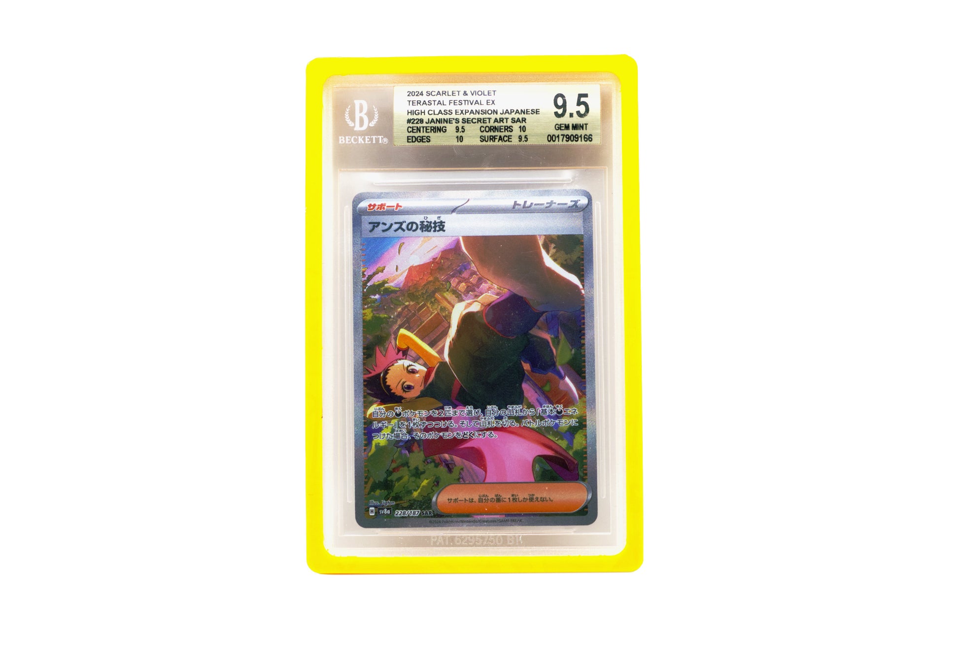 The yellow Beckett Card Slab Protector shown with Janine from the Pokemon TCG in it against a white background