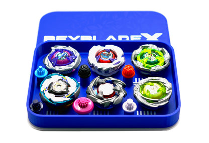 The Pocket Deck Box that holds 6 beys for Beyblade X shown in the blue and white color combination. Showcasing Shark Scale, Meteor Dragoon, Wizard Rod, Emperor Pegasus Blast, Cobalt Dragoon, and Hover Wyvern. 