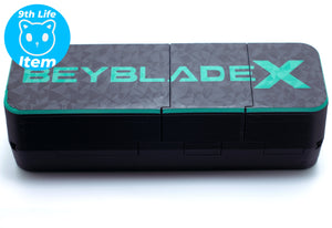 A Beyblade X toy box or storage case with a dark gray and black geometric pattern lid featuring a bright green 'BEYBLADE X' logo, shown on a white background.