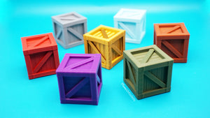 Colorful 3d printed toy crates on a blue background