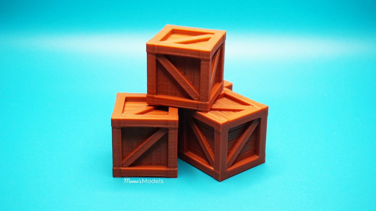 Three wooden crate models stacked on a blue background
