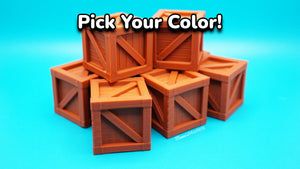 Stack of brown 3d printed wooden crates on a blue background with text 'Pick Your Color!'.