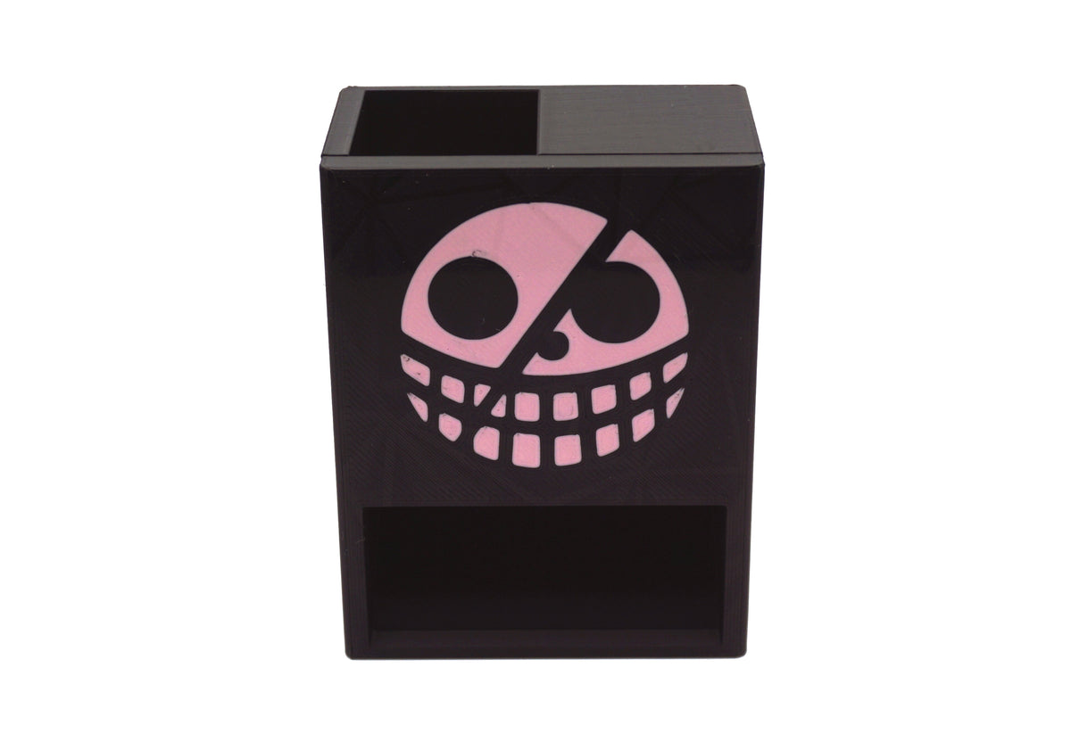 Close up picture of the Donquixote pirates jolly roger on the One Piece Mini Dice Tower against a white background