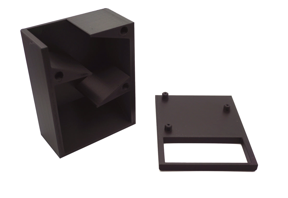 Breakdown picture of the One Piece Mini Dice tower with the face plate taken off to show the inside of the tower with the amount of randomizers