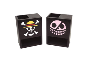 The One Piece Mini Dice Towers of the Strawhats and Donquixote pirates jolly roger symbols on a white background