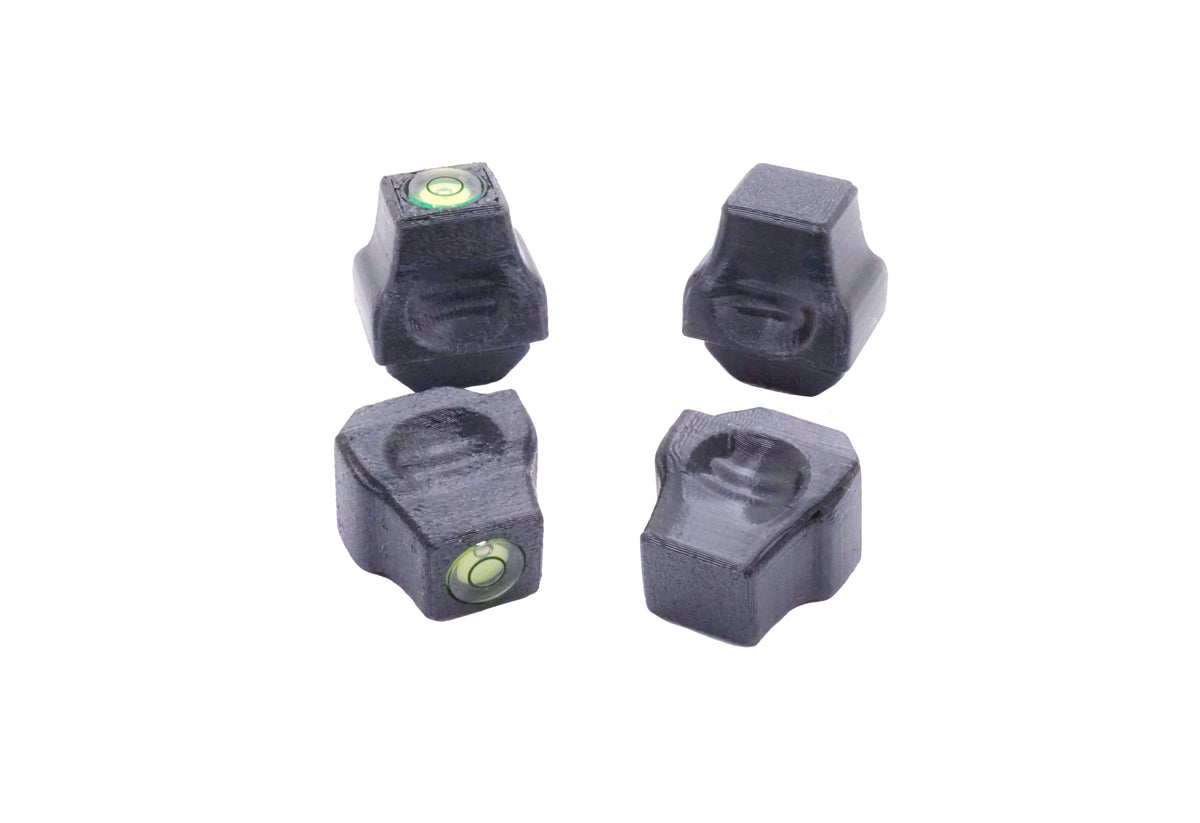 The Stadium Level Locks for Beyblade X stadiums shown in black. With two having levels and two without levels. These will work for both Takara Tomy and Hasbro stadiums