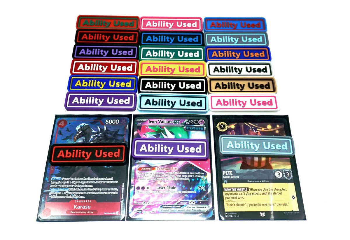 Ability Used markers for TCG and Tabletop gameplay. Shown in a variety of colors against a white background. Three of which are on top of cards from Pokemon, One Piece, and Lorcana
