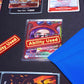 A Red and Yellow Ability User Marker sits on top of the Belo Betty leader alt art card with the hand face down next to it, all on top of a black playmat