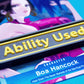 A black Ability Used marker with yellow text shown on top of a Boa Hancock card from the One Piece TCG.