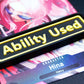A black Ability Used marker with yellow text shown on top of a Hina card from the One Piece TCG.