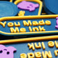 Multiple You Made Me Ink markers stacked on top of each other shown in blue and yellow with Pearl in lavender 