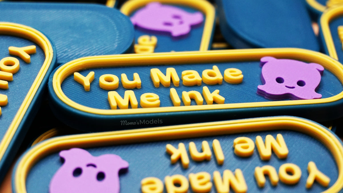 Multiple You Made Me Ink markers stacked on top of each other shown in blue and yellow with Pearl in lavender 