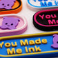 Colorful Lorcana TCG  markers with 'You Made Me Ink' text and Pearl in lavender on a white background.